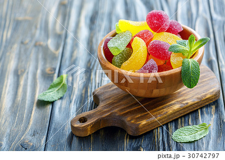 Fruit marmalade in a wooden bowl. Fruit marmalade in a wooden bowl. 30742797