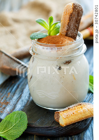 Glass jar with Savoiardi and whipped cream cheese. Glass jar with Savoiardi and whipped cream cheese. 30742801