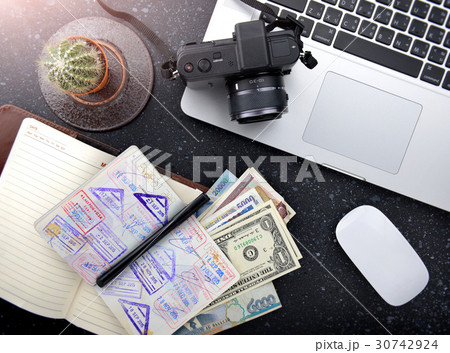 Tourism plan desktop with passport. Tourism plan desktop with passport. 30742924