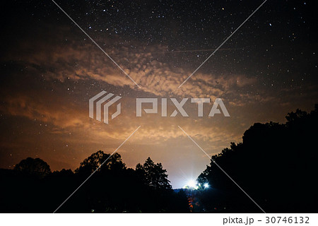 A clear night sky with a hill and trees A clear night sky with a hill and trees 30746132