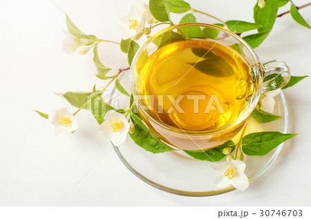 Cup of tea with jasmine on table close-up Cup of tea with jasmine on table close-up 30746703