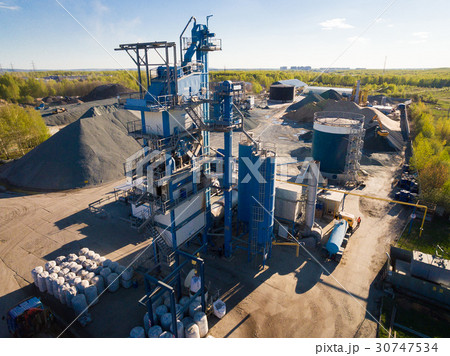 asphalt-concrete plant in the field among the asphalt-concrete plant in the field among the 30747534