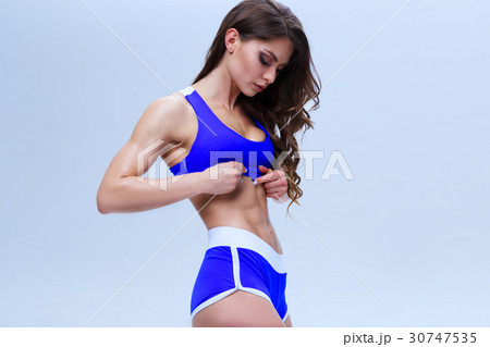 Beautiful fitness girl in a blue sport underwear Beautiful fitness girl in a blue sport underwear 30747535