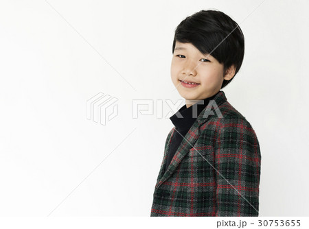 Asian boy is in a studio shoot. Asian boy is in a studio shoot. 30753655