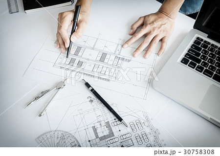 Close-up Of Person's engineer Hand Drawing Plan On Blue Print wi 30758308