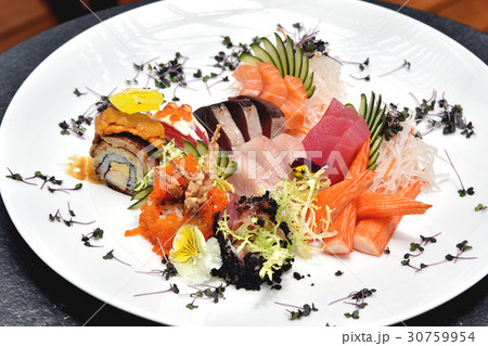 Fresh fish sashimi and rice roll. 30759954