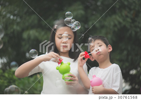 asian children is blowing a soap asian children is blowing a soap 30761568