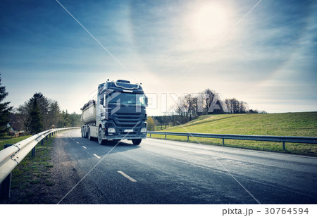lorry moving on sunny evening 30764594