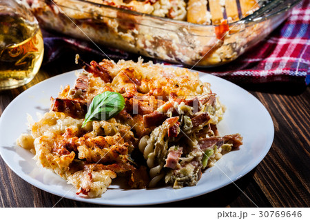 Portion of fusilli pasta casseroles 30769646