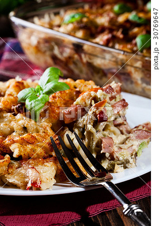 Portion of fusilli pasta casseroles 30769647