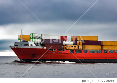 Red cargo container ship's bow 30770894