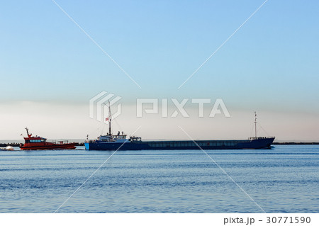 Blue cargo ship 30771590