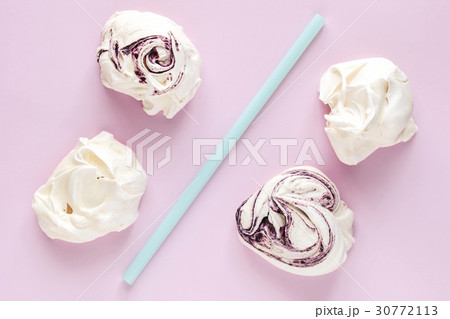 Meringues and drinking straws on pink background Meringues and drinking straws on pink background 30772113