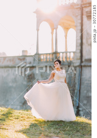 The full-length view of the stylish bride at the The full-length view of the stylish bride at the 30772185