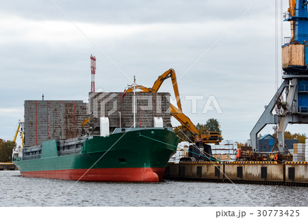 Green cargo ship loading Green cargo ship loading 30773425