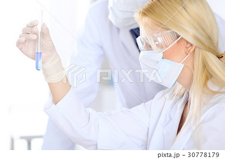Female scientific research team with clear Female scientific research team with clear 30778179