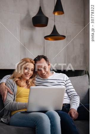 Peaceful mature couple enjoying weekend at home Peaceful mature couple enjoying weekend at home 30778322