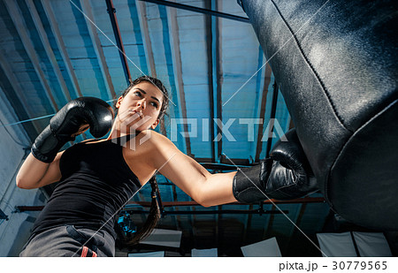 The female boxer training at gym The female boxer training at gym 30779565