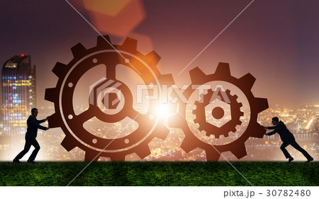Businessman in teamwork concept with cogwheels Businessman in teamwork concept with cogwheels 30782480