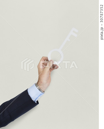 Business Man Holding Key 30787352
