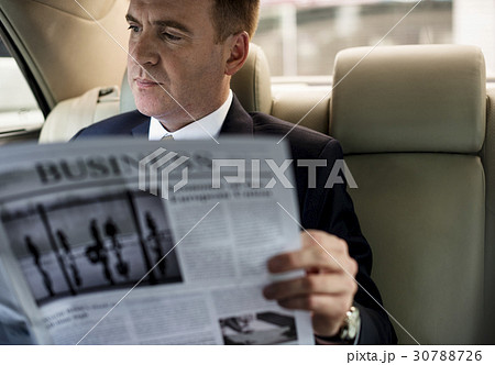 Businessman Reading Newspaper Car Inside Businessman Reading Newspaper Car Inside 30788726