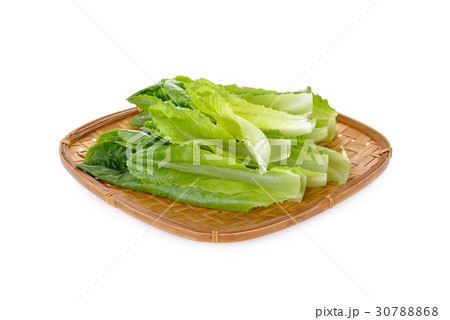 fresh green cos in bamboo tray on white background 30788868