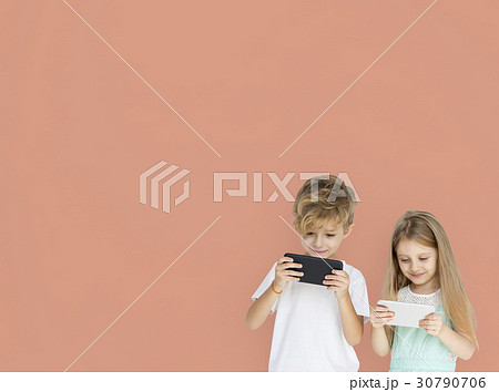 Young Kids Playing Mobile Phone 30790706