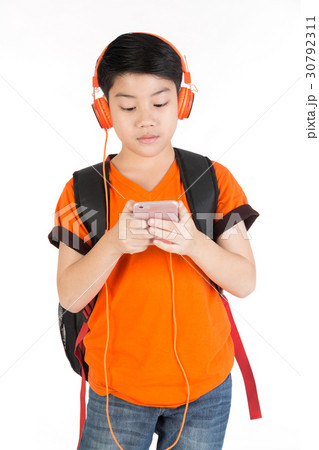 Asian boy use of the mobile phone Asian boy use of the mobile phone 30792311