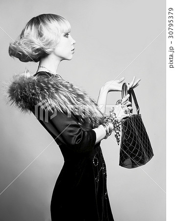 Young beautiful lady in elegant dress 30795379