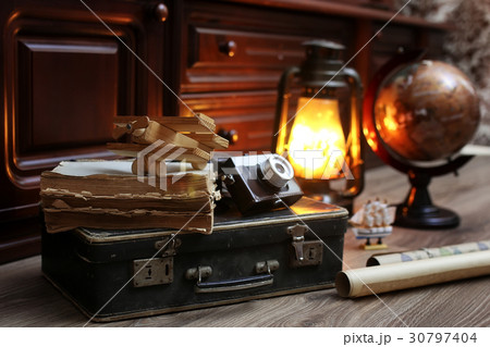 wooden floor vintage globe with old leather suit 30797404