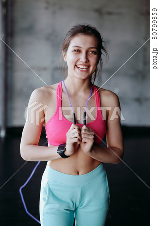 beautiful woman with skipping rope in the gym 30799359