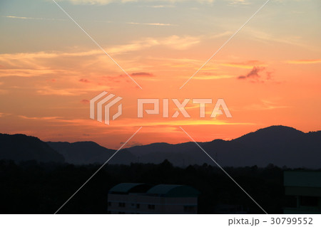 Sunset in sky color evening  with city silhouette 30799552