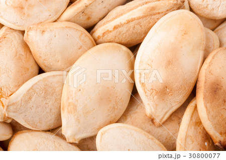 peeled pumpkin seeds or whole background macro 30800077