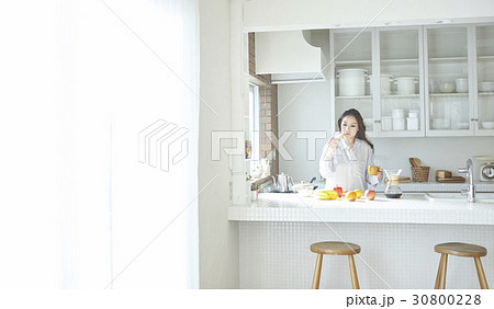 lady has a healthy breakfast in luxury kitchen lady has a healthy breakfast in luxury kitchen 30800228