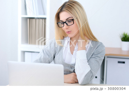 Young business woman or student girl sitting at Young business woman or student girl sitting at 30800304