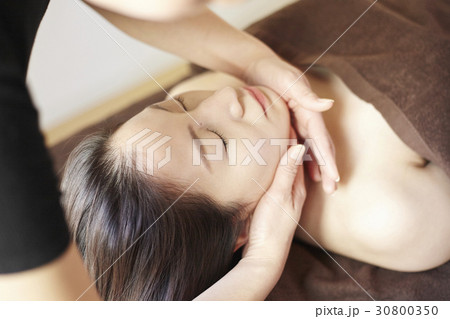 hands are massaging neck and face. hands are massaging neck and face. 30800350