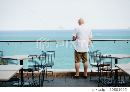 man relax in cafe with sea view 30801035