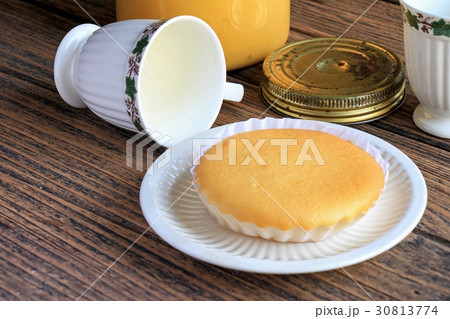 A soft homemade cake with english tea. 30813774