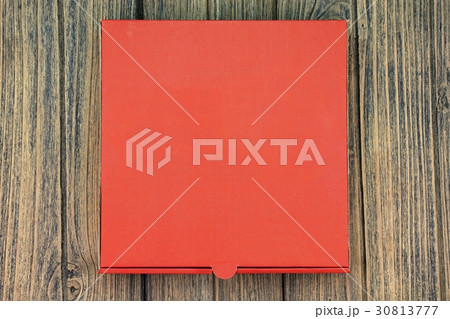 A red cardboard pizza box with copy space. A red cardboard pizza box with copy space. 30813777
