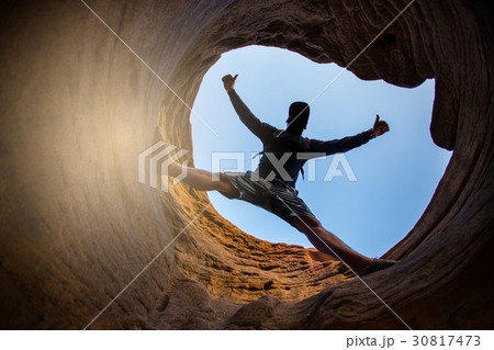 Young man climbing the mountain ridge 30817473