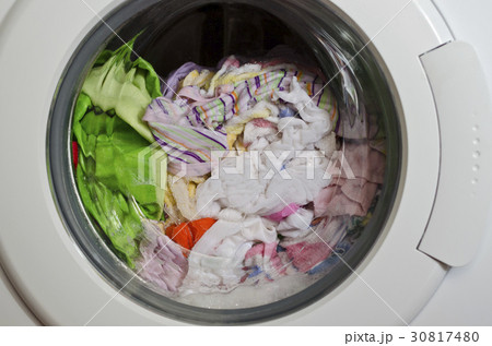 Washing machine door with rotating garments inside 30817480