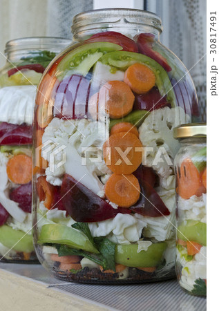 Pickled organic vegetables in glass jars 30817491