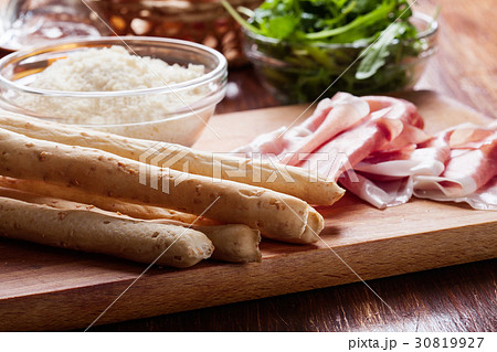 Italian grissini with ham prosciutto Italian grissini with ham prosciutto 30819927