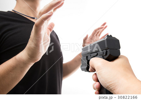 Robber with a gun intimidate a man surrender. Robber with a gun intimidate a man surrender. 30822166