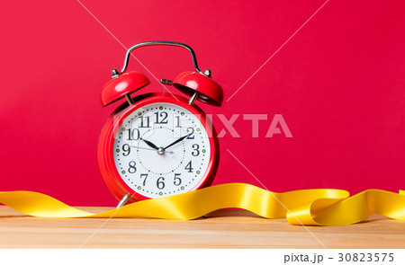 alarm clock and ribbon 30823575
