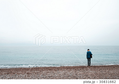 Alone boy stay near sea 30831662