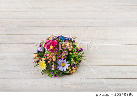 Composition made of artificial flowers, fruits, butterflies, birds and ears of wheat. 30840396
