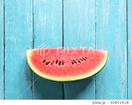 watermelon slice on ocean blue wood table summer 30841018