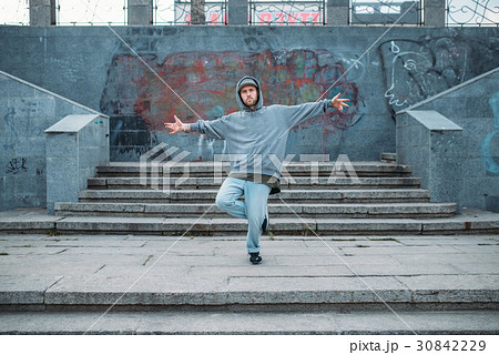 Rap performer posing on the steps, street dancing Rap performer posing on the steps, street dancing 30842229