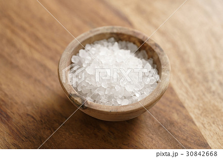 coarse sea salt in wooden bowl on table coarse sea salt in wooden bowl on table 30842668